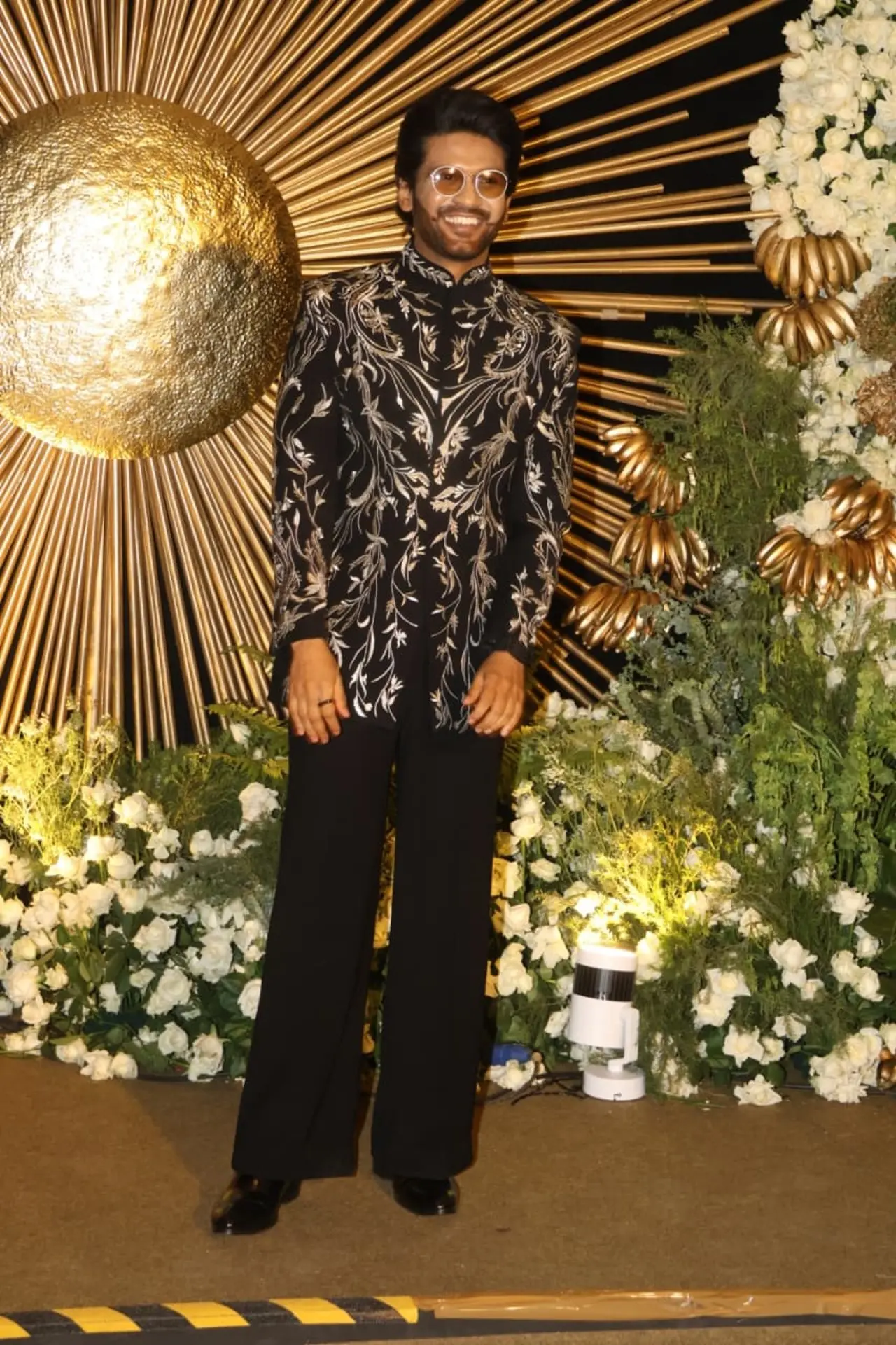 Naveen Polishetty made a stylish statement at the reception in a black embroidered sherwani paired with matching trousers.